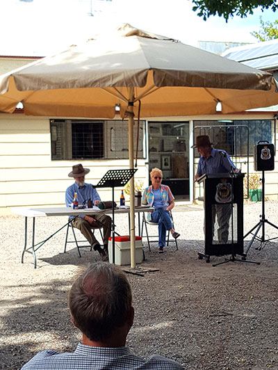 Brian Lewis, Jan Wherrey and Jim Davis at the podium