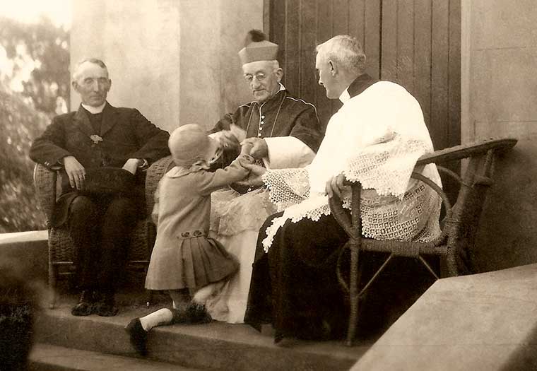 Joan McNamara presents to Archbishop Spence